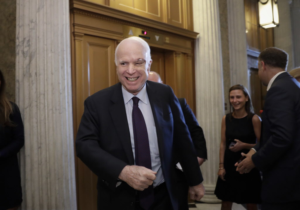 Sen. John McCain, R-Ariz., who returned to Capitol Hill after being diagnosed with an aggressive type of brain cancer, smiles as he arrives to vote as the Republican-run Senate rejected a GOP proposal to scuttle President Barack Obama's health care law, Wednesday, July 26, 2017, in Washington. President Donald Trump and Senate Majority Leader Mitch McConnell, R-Ky., have been stymied by opposition from within the Republican ranks. (AP Photo/J. Scott Applewhite)