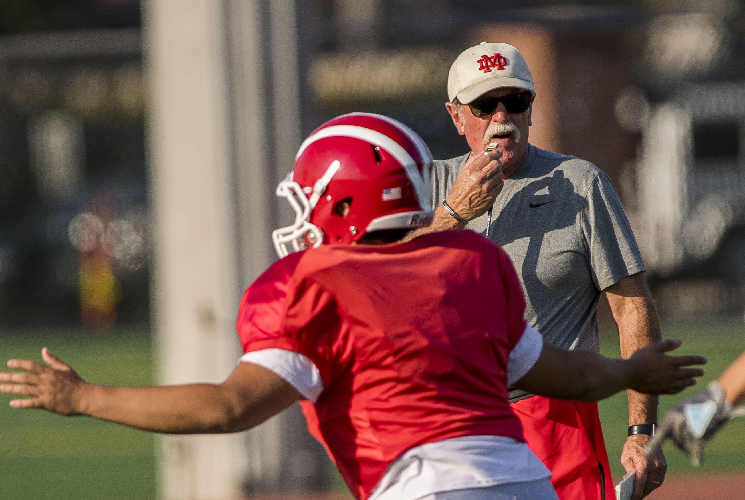 Mater Dei High School football coach Bruce Rollinson watches his players as they run through drills during practice in Santa Ana on Tuesday, August 29, 2017. (Photo by Paul Rodriguez, Orange County Register/SCNG)